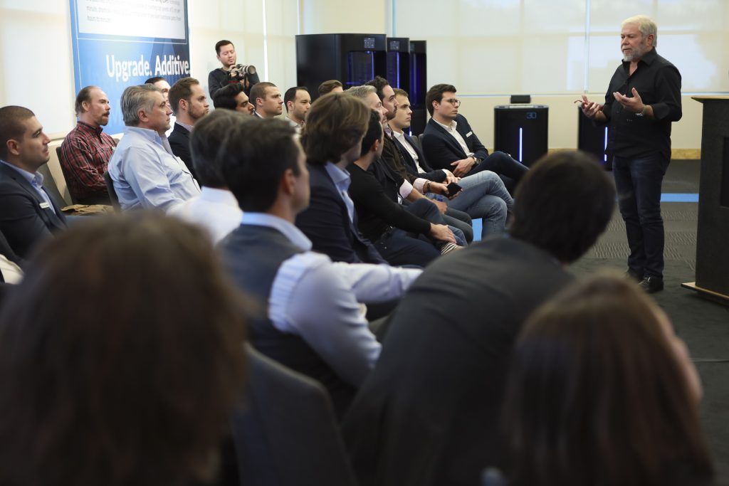 Avi Reichental during a meeting at XponentialWorks talking Nexa3D (printers in background). Photo via XponentialWorks.